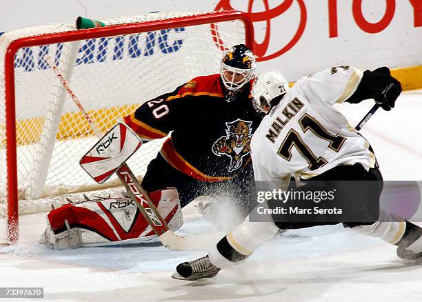 Center Evgeni Malkin of the Pittsburgh Penguins shoots against goalie Ed Belfour the Florida Panthers February 22, 2007 at the BankAtlantic Center in...