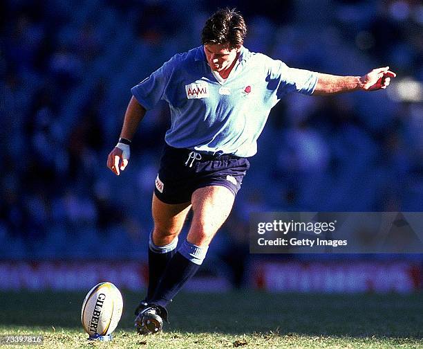 Matthew Burke of the Waratahs kicks for a goal during the Super 12 match between the NSW Waratahs and Otago held at the Sydney Football Stadium, 1996...