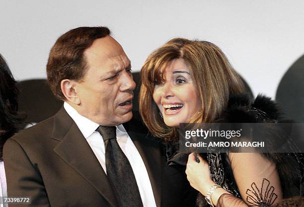 Egyptian top actor Adel Imam shares a moment with actress Mervat Amin during a press conference to announce their new movie "Murjan" in Cairo, late...