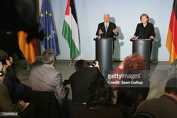 Palestinian President Mahmoud Abbas and German Chancellor Angela Merkel speak to the media after talks on February 23, 2007 in Berlin, Germany....