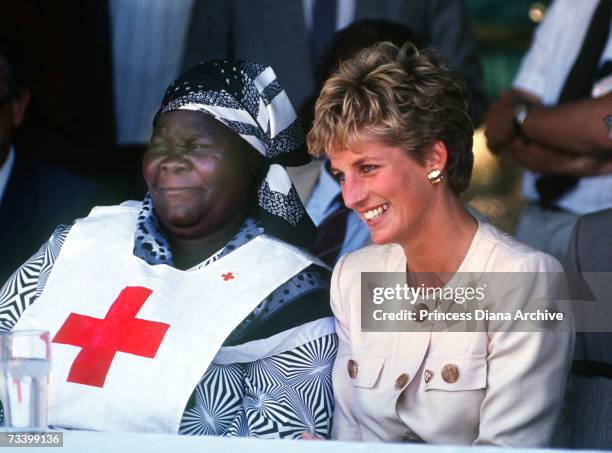 Princess Diana during a visit to the Red Cross borehole project for refugees in Zimbabwe, July 1993. She is wearing a safari suit by Catherine Walker.