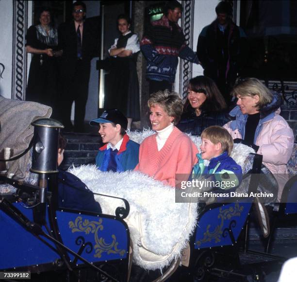 Princess Diana with her sons Prince William and Prince Harry and friends Kate Menzies and Catherine Soames in a horse-drawn sleigh during a skiing...