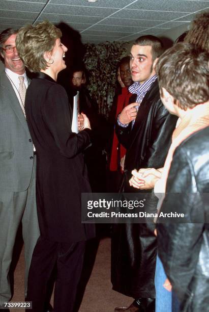 Princess Diana meets pop singer Robbie Williams and other members of boy-band Take That at a 'Concert Of Hope' AIDS benefit at Wembley Arena, London,...