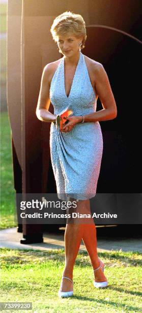 Princess Diana arrives at the Serpentine Gallery, London, June 1995. She is wearing a grey, beaded, halter-neck dress by Catherine Walker.