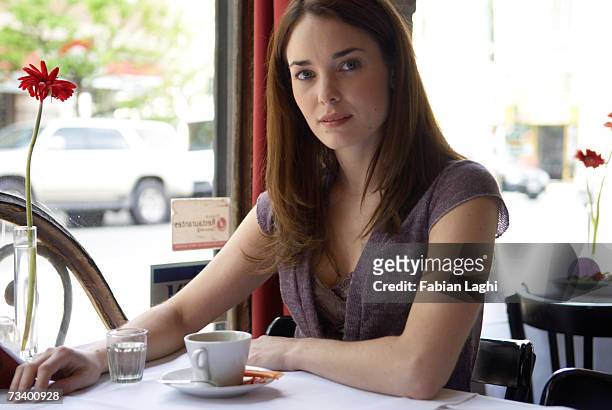 young woman sitting in caft, portrait - caft stock pictures, royalty-free photos & images