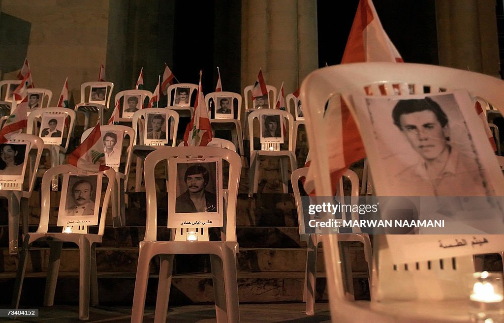 Candles lit the pictures of Lebanese civ...