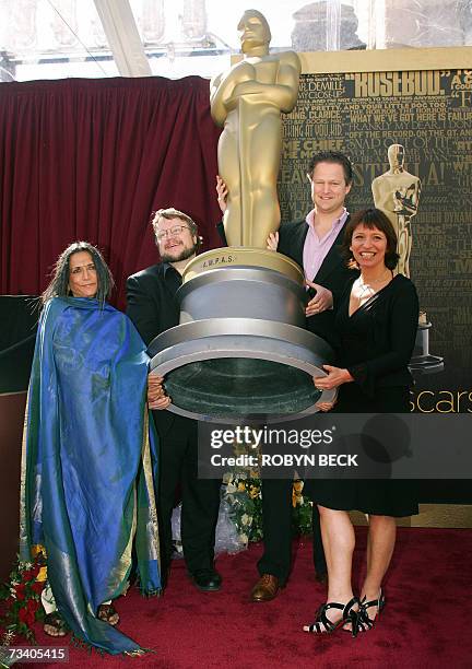 Hollywood, UNITED STATES: Four of the five Academy Award nominated directors in the Foreign Language Film Award Category pose with an Oscar statue...