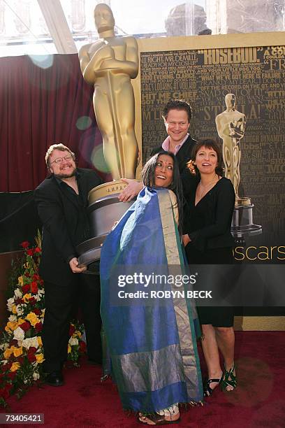Hollywood, UNITED STATES: Four of the five Academy Award nominated directors in the Foreign Language Film Award Category pose with an Oscar statue...