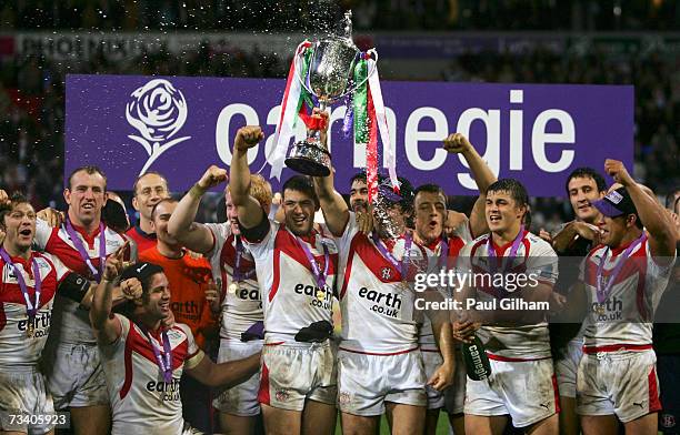 The St Helens players celebrate their victory with the trophy at the end of the Carnegie World Club Challenge match between St Helens and Brisbane...