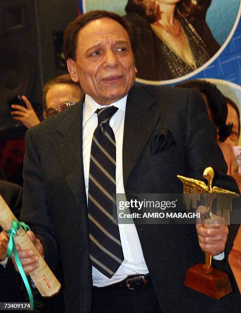 Egyptian actor Adel Imam holds his best actor prize for late Marwan Hamed's movie Amarat Yacoubian late 23 February 2007 during the the 28th Oscar of...