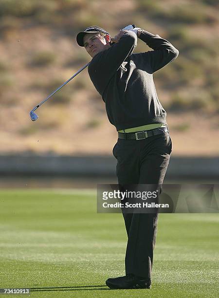 Justin Rose of England hits his approach shot on the fourth hole during the fourth round of the WGC-Accenture Match Play Championships on February...