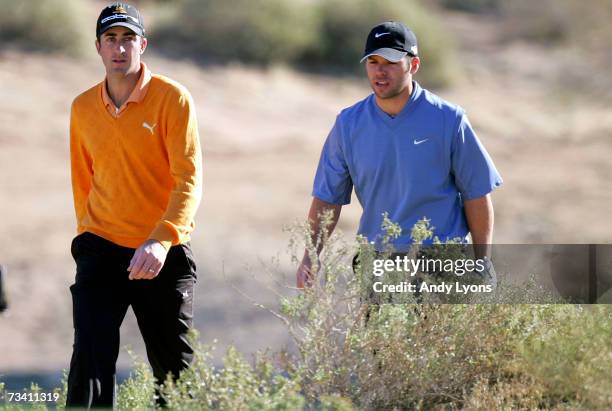 Geoff Ogilvy of Australia and Paul Casey of England walk together on the fourth hole in their match during the fourth Round of the WGC-Accenture...