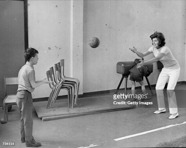 Eunice Shriver seen playing ball with a mentally handicapped child in Paris 1969. Shriver, founder of the Special Olympics was on a trip to Europe...