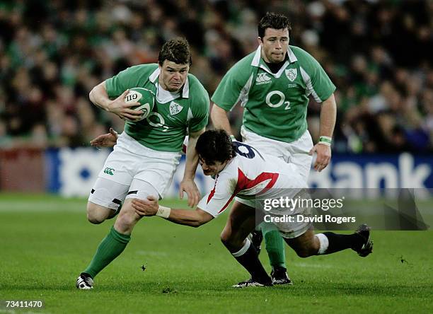 Brian O'Driscoll of Ireland is tackled by Harry Ellis of England during the RBS Six Nations Championship match between Ireland and England at Croke...