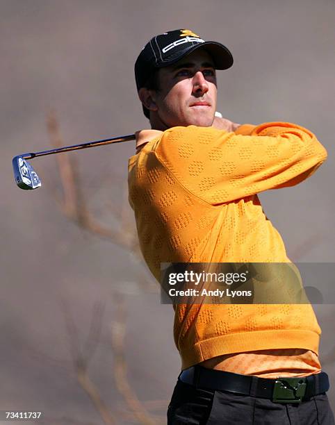 Geoff Ogilvy of Australia hits his tee shot on the 14th hole in his match against Paul Casey of England during the fourth Round of the WGC-Accenture...