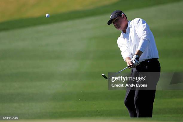 Chad Campbell hits his second shot on the 12th hole in his match against Stephen Ames of Canada during the fourth Round of the WGC-Accenture Match...