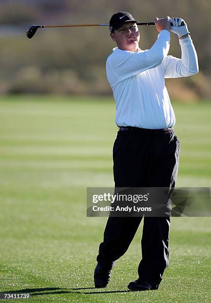 Chad Campbell hits his second shot on the 1st hole in his match against Stephen Ames of Canada during the fourth Round of the WGC-Accenture Match...