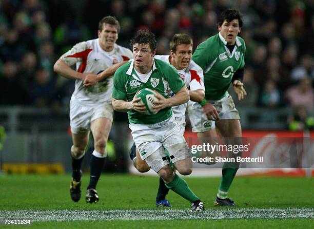 Brian O'Driscoll of Ireland leaves the English defence in his wake during the RBS Six Nations Championship match between Ireland and England at Croke...