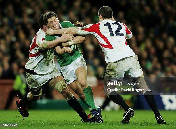 Ronan O?Gara of Ireland is tackled by Andy Farrell of England during the RBS Six Nations Championship match between Ireland and England at Croke Park...