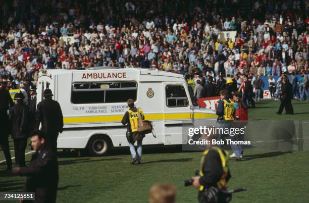 An ambulance on the pitch at Hillsborough football stadium in Sheffield, after a human crush at an FA Cup semi-final game between Liverpool and...