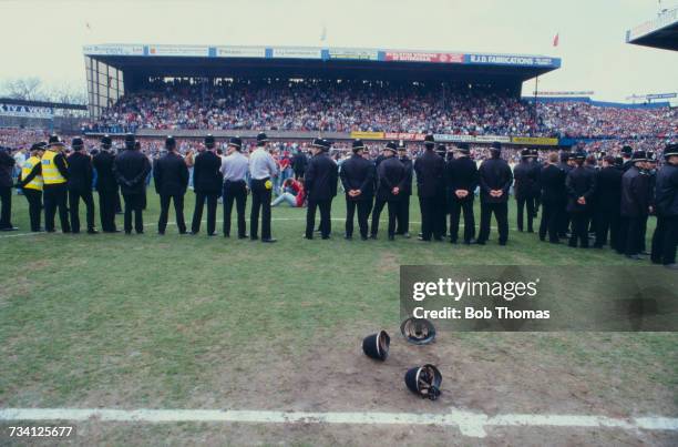 Police officers on the pitch at Hillsborough football stadium in Sheffield, after a human crush at an FA Cup semi-final game between Liverpool and...