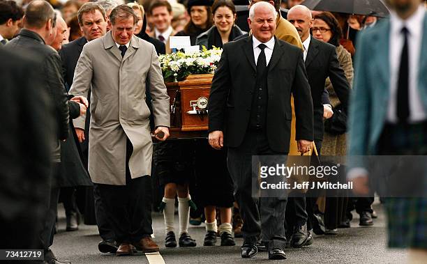 Family members and friends carry the coffin of Chief of Clan MacLeod, John MacLeod into the burial ground at the old ruined church at Kilmuir,...