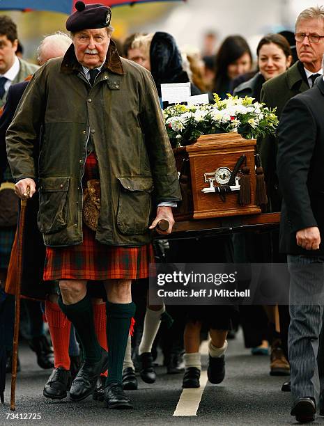 Family members and friends of Chief of Clan MacLeod, John MacLeod walk to the burial ground at the old ruined church at Kilmuir, Dunvegan on the Isle...