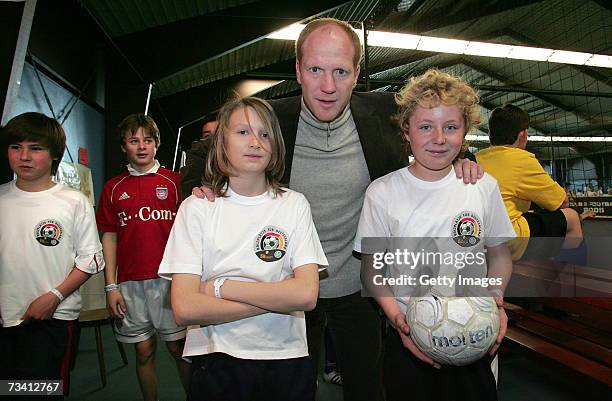 Matthias Sammer and children during the 'Play Soccer, Get Together' charity tournament sponsored by Bitburger on February 24, 2007 in Munich, Germany.