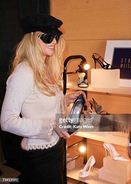 Actress Nicolette Sheridan attends The Stuart Weitzman luxury suite showcasing an exclusive Oscar shoe collection; skin care products by Mario...