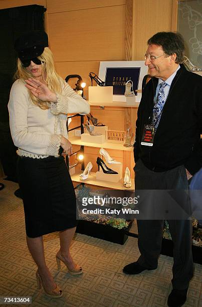 Actress Nicolette Sheridan and Stuart Weitzman attend The Stuart Weitzman luxury suite showcasing an exclusive Oscar shoe collection; skin care...