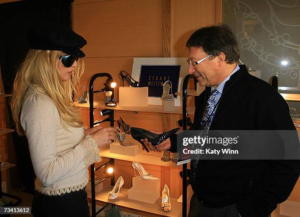 Actress Nicolette Sheridan and Stuart Weitzman attend The Stuart Weitzman luxury suite showcasing an exclusive Oscar shoe collection; skin care...