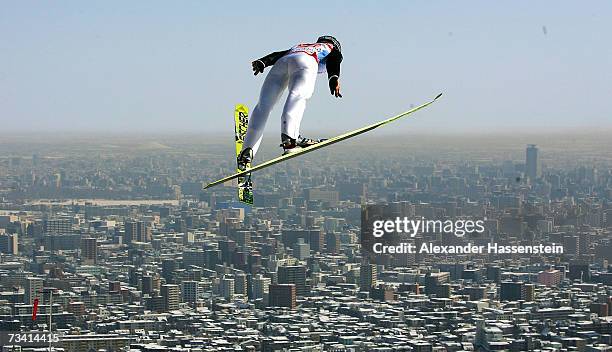 Seppi Hurschler of Switzerland soars trough the air in the Jumping of the Nordic Combined Team Event during the FIS Nordic World Ski Championships...