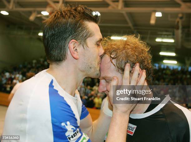 Guillaume Gille kisses Goran Stojanovic of Hamburg after the Handball European Cup Winners Cup game between HSV Handball and HC portovik Yuzhny at...