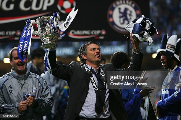 Chelsea Manager Jose Mourinho celebrates with the trophy following his team's victory at the end of the Carling Cup Final match between Chelsea and...