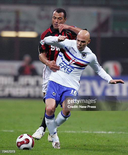 Cafu of AC Milan and Andrea Parola of Sampdoria fight for the ball during the Serie A match between AC Milan and Sampdoria at the Stadio Giuseppe on...