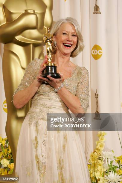 Los Angeles, UNITED STATES: Helen Mirren, the winner for Best Actress for her work in "The Queen" poses with her Oscar trophy at the 79th Academy...