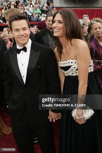 Hollywood, UNITED STATES: Mark Wahlberg, nominee for Best Supporting Actor for his work in "The Departed," and model Rhea Durham arrive at the 79th...