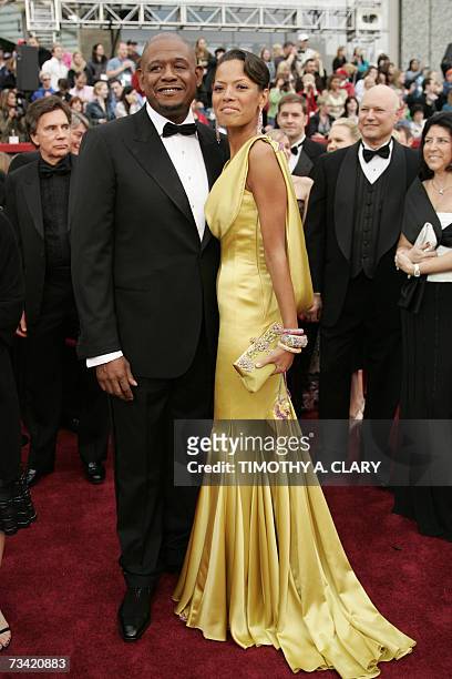 Hollywood, UNITED STATES: Forest Whitaker, nominee for Best Actor for his work in "The Last King of Scotland," and wife Keisha arrives at the 79th...