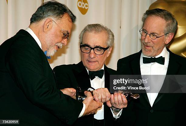 Presenter Francis Ford Coppola, winner of Best Achievement in Directing for "The Departed" Martin Scorsese, and presenter Steven Spielberg pose in...