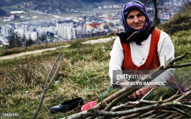 Gorazde, BOSNIA AND HERCEGOVINA: Bosnian Muslim woman Rahima Suljevic, refugee from Eastern Bosnian town of Visegrad, rests 25 February 2007 after...
