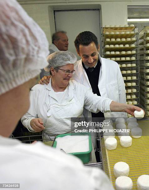 French right-wing presidential candidate Nicolas Sarkozy visits a "Crottin de Chavignol" cheese factory in Chavignol, 26 February 2007, as part of a...