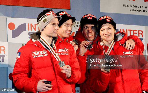 Norway's Anders Jacobsen, Roar Ljoekelsoey, Anders Bardal and Tom Hilde take the Silver Medal during the FIS Nordic World Ski Championships Ski...