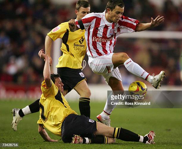 Lee Hendrie of Stoke is chalenged by Sam Togwel of Barnsley during the Coca-cola Championship match between Stoke City and Barnsley at the Britannia...