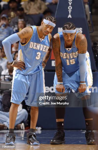 Allen Iverson and Carmelo Anthony of the Denver Nuggets talk strategy on February 26, 2007 at FedExForum in Memphis, Tennessee. NOTE TO USER: User...