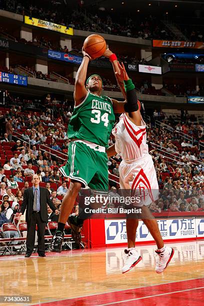 Paul Pierce of the Boston Celtics shoots the ball over Bonzi Wells of the Houston Rockets on February 26, 2007 at the Toyota Center in Houston,...