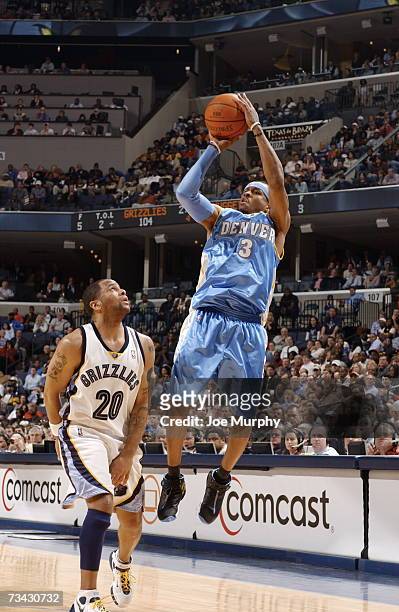 Allen Iverson of the Denver Nuggets shoots over Damon Stoudamire of the Memphis Grizzlies on February 26, 2007 at FedExForum in Memphis, Tennessee....