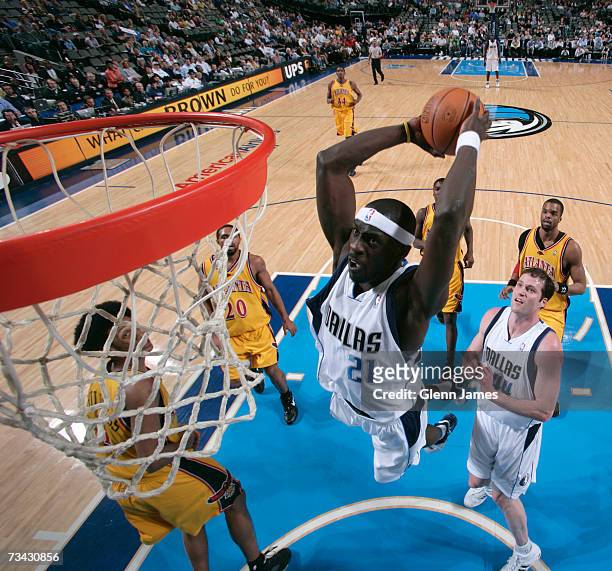 Pops Mensah-Bonsu of the Dallas Mavericks dunks the final play of the game against the Atlanta Hawks on February 26, 2007 at the American Airlines...