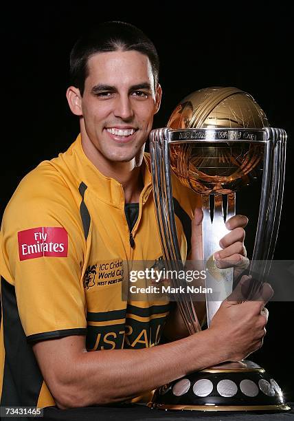 Mitchell Johnson of Australia poses with the 2003 World Cup trophy during the Australian Cricket team World Cup portrait session at The Hilton Hotel...