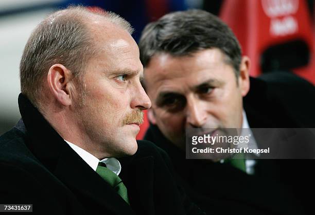 Head coahc Thomas Schaaf and manager Klaus Allofs of Bremen look on during the UEFA Cup round of 32 second leg match between Ajax Amsterdam and...