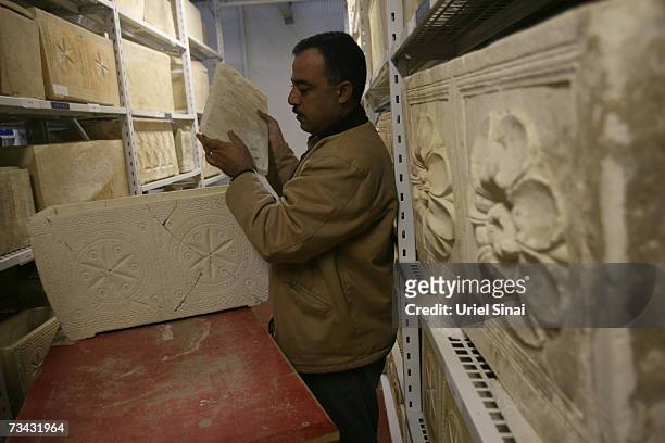 Workers carry a 1st century AD stone ossuary , which was found in a burial tomb in the Jerusalem neighborhood of Talpiot and excavated by Israeli...